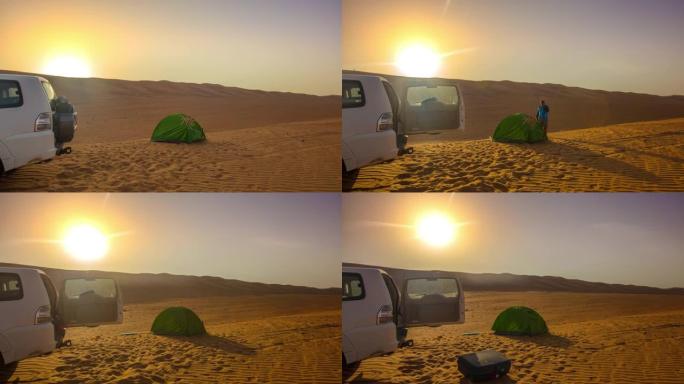 日出时在沙漠中露营