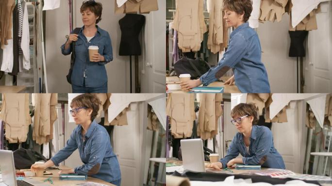 女裁缝师带着咖啡进入缝纫工作室，在笔记本电脑上工作