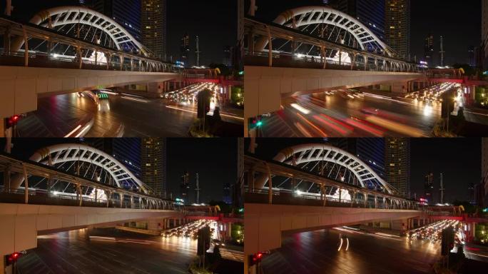 延时和宽幅镜头: 曼谷夜间交通在崇非树。