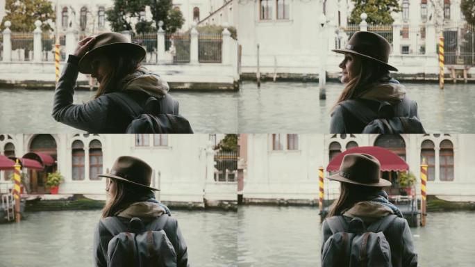 快乐放松的高加索旅游女性在秋季威尼斯度假期间享受惊人的贡多拉游览之旅的背景图