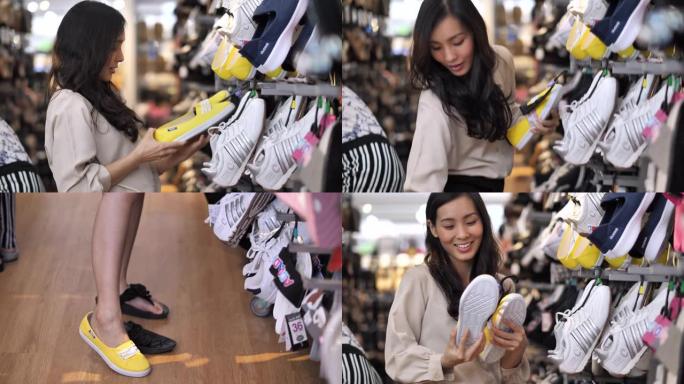 年轻的亚洲女性在商店选择鞋子