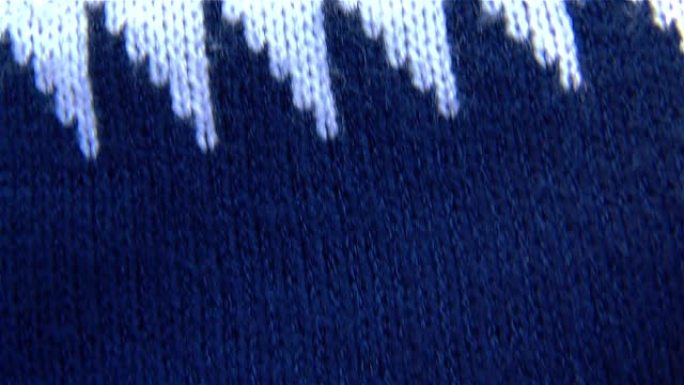 蓝色羊毛衫。纺织毛纺花纹