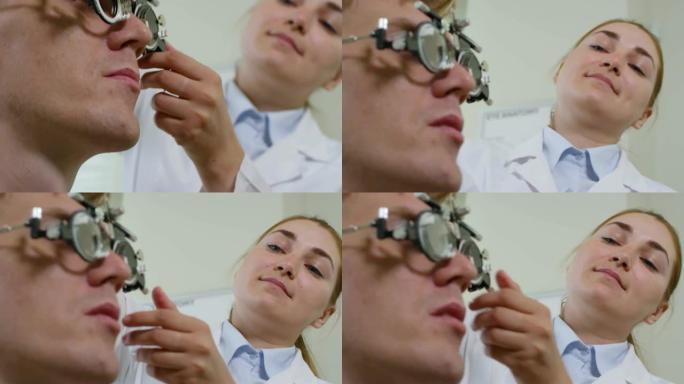 开朗的验光师检查男性患者的视力