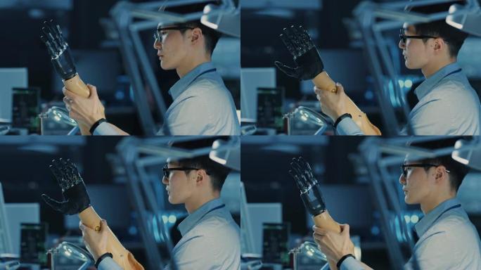 未来的假肢机器人手臂由专业的日本开发工程师在高科技研究实验室中使用现代计算机设备进行测试。