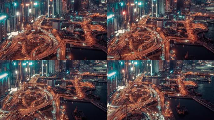 4k分辨率无人机视角香港城市超限，夜间十字路口鸟瞰图。香港交通运输概念