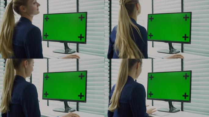 女商人使用电脑显示器绿屏