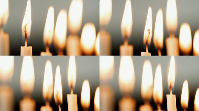 在一组蜡烛上放火的火焰，为犹太节日光明节燃烧