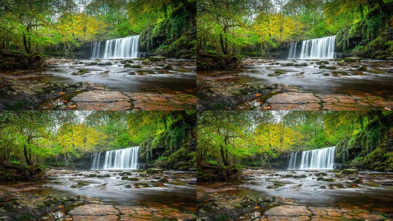 美丽的瀑布在森林在威尔士-时间推移跟踪拍摄