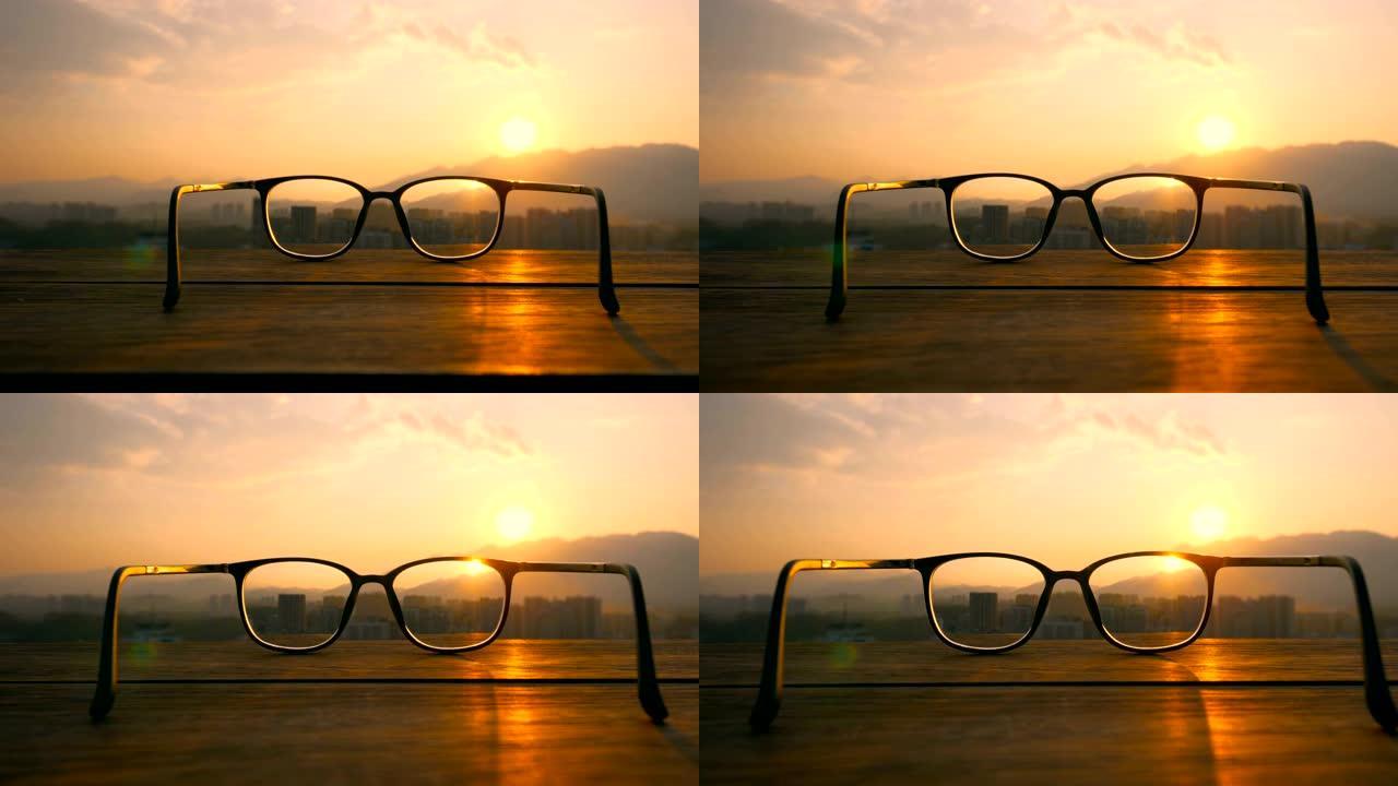 日落桌上的眼镜逆光剪影黄昏夕阳