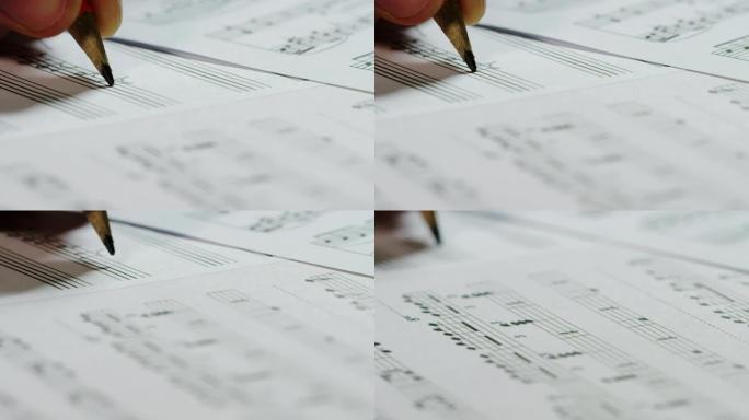 音乐家作曲家在空的五角星上写下他的新歌或歌剧的音符。这位音乐家创作他的新音乐。