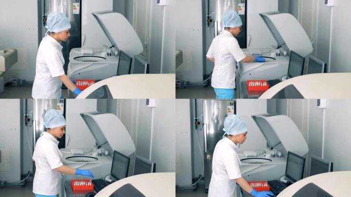 护士使用现代自动化医疗设备进行血液检查。
