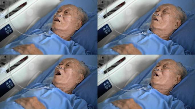 老年亚洲男性患者在医院床上呼吸困难