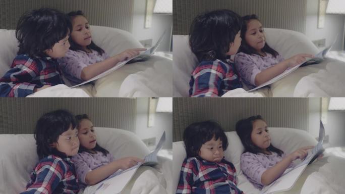 女孩和男孩正在家里的床上看书
