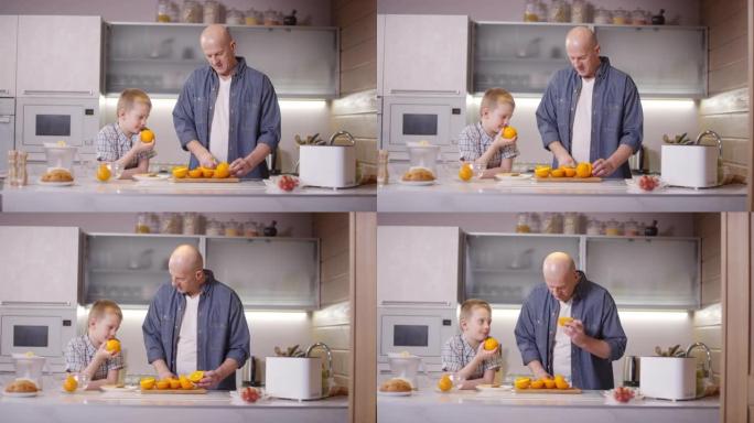 父子在厨房切橘子