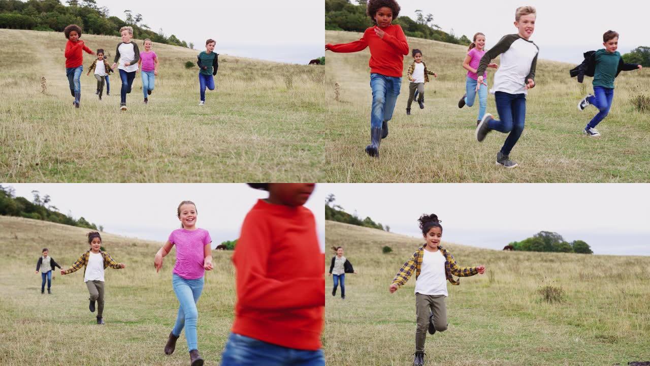 一群儿童在户外活动野营下奔跑的前视图
