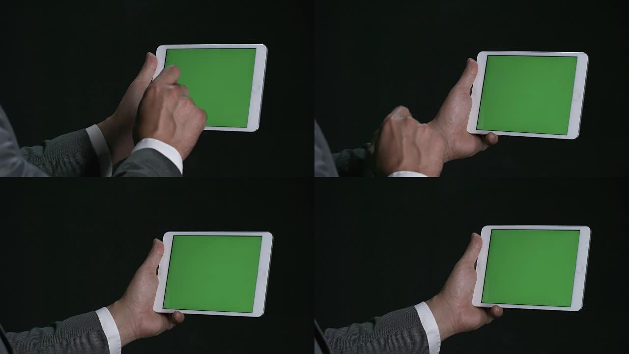 男人使用带色度键的平板电脑