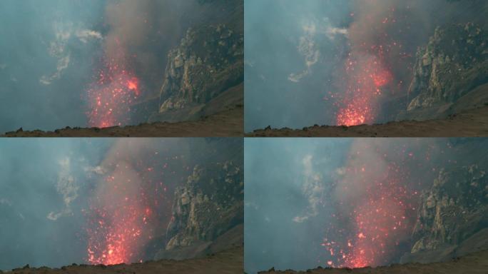 慢动作: 明亮的橙色岩浆碎片被从活火山中炸开。