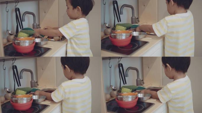 亚洲小孩在家玩耍小孩子做家务洗碗