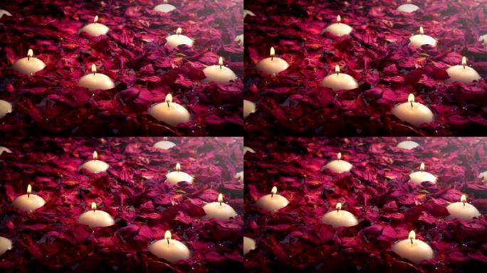 水疗中心的漂浮蜡烛和花瓣