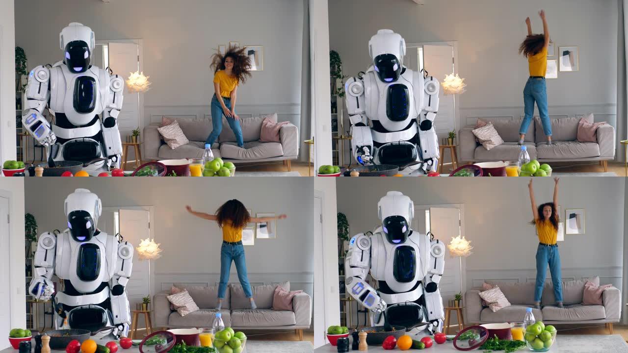 一位女士在沙发上跳着，而机器人正在做饭