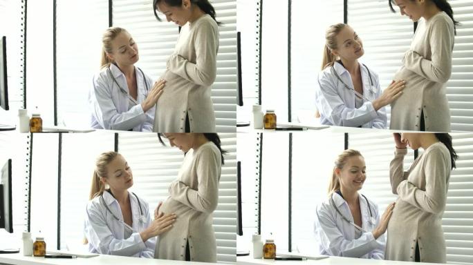 妇科医生在医生办公室与孕妇交谈