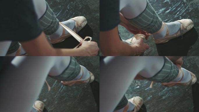 芭蕾舞演员在工作室系鞋带