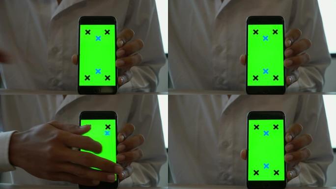男子展示绿屏智能手机