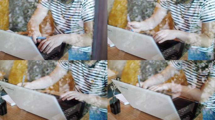 慢动作: 妇女使用笔记本电脑在笔记本上工作和书写，在家工作