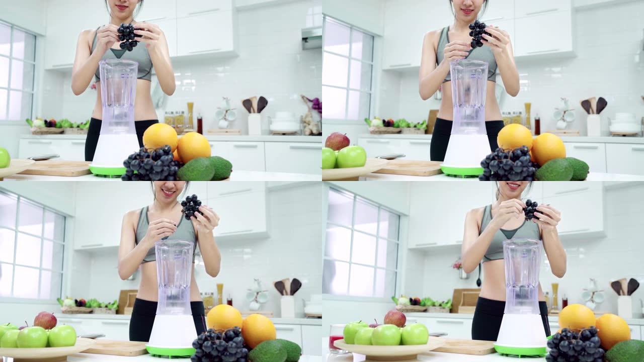 4K UHD: 女人在厨房准备水果冰沙。