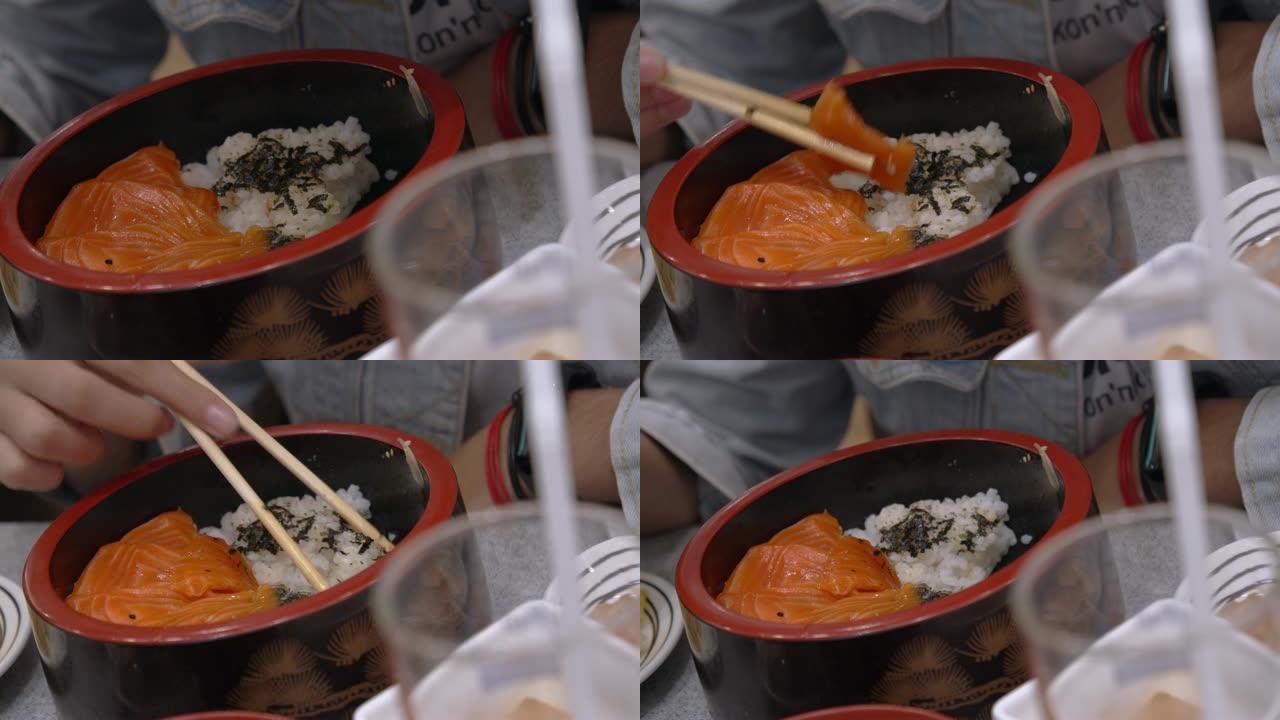 鲑鱼唐的4k镜头。三文鱼生鱼片蒸饭，日本传统食品