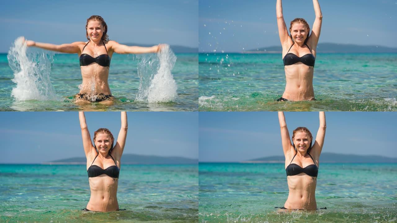 热带度假时穿着比基尼的快乐女人在炎热阳光明媚的夏日里溅海水