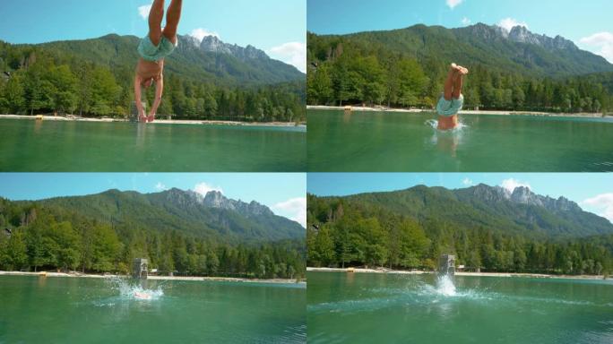 慢动作: 活跃的男性游客首先跳入令人耳目一新的湖泊。