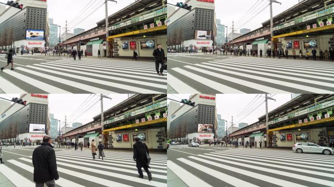行人和汽车人群的4k时间流逝未定义的人走立交桥在日本东京市的街道交叉路口。日本文化与旅游理念