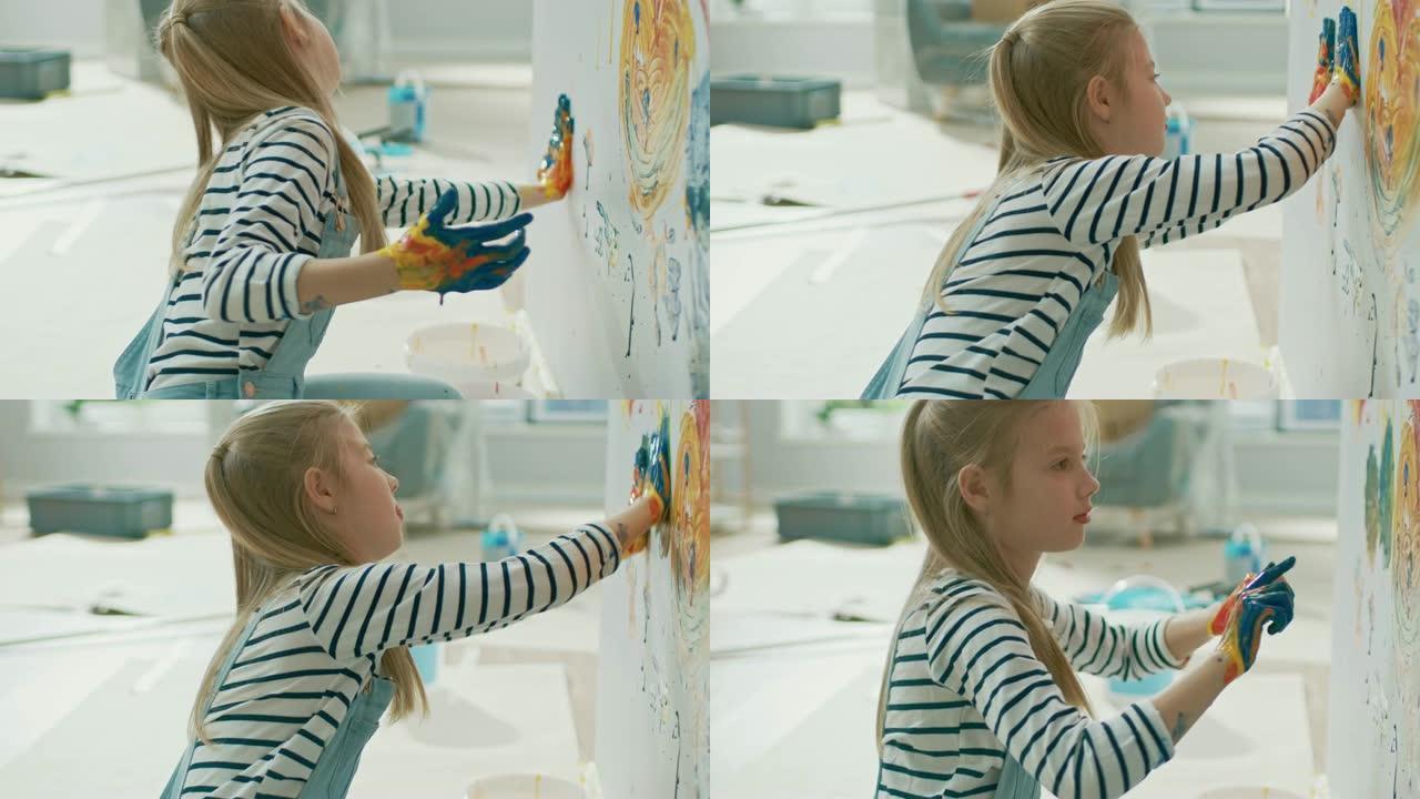 双手蘸亮漆的快乐小女孩在墙上贴了五颜六色的手印。她玩得很开心，笑得很开心。家正在装修。