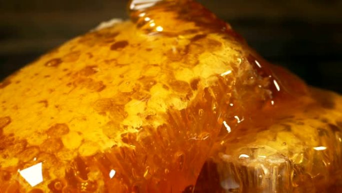 Honey Pouring On Honeycomb Closeup