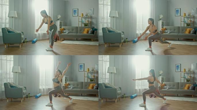穿着运动上衣的美丽自信丰满的健身女孩正在她明亮宽敞的公寓里做伸展瑜伽练习，室内简约。