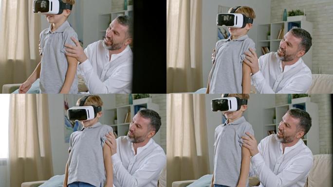 父亲帮助男孩玩VR游戏