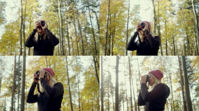 秋天森林中的女摄影师