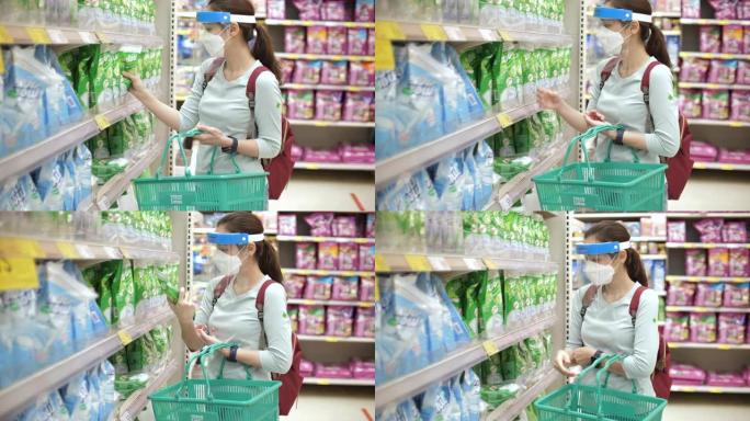 新型冠状病毒肺炎病毒后的新常态生活，亚洲妇女戴着口罩和口罩在超市购物