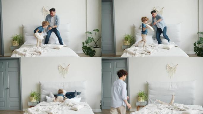 父亲和儿子在床上玩耍战斗枕头掉下来然后母亲回家