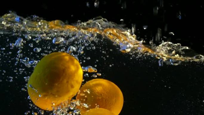 甜橙蘸水慢动作鲜橙清洗入水