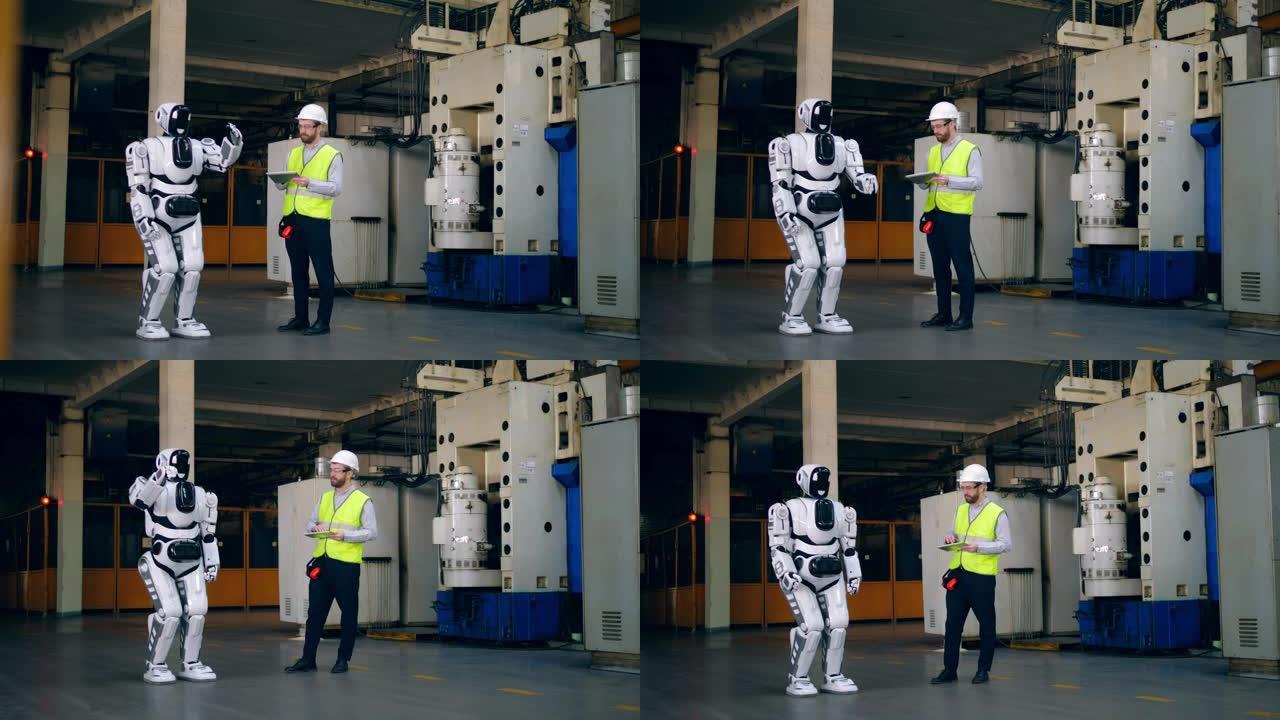 男技术员正在控制机器人的动作