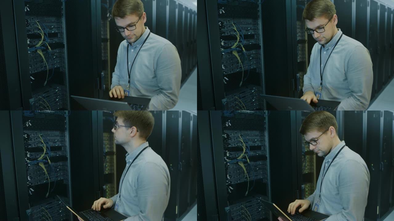 在数据中心，IT工程师站在工作服务器机架之前，使用笔记本电脑进行日常维护检查和诊断。可见计算机硬件设