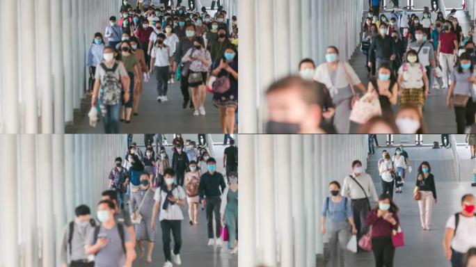 时间流逝模糊背景人群亚洲人在早上高峰时间去曼谷工作场所时，穿着面部保护装置预防冠状病毒或新型冠状病毒