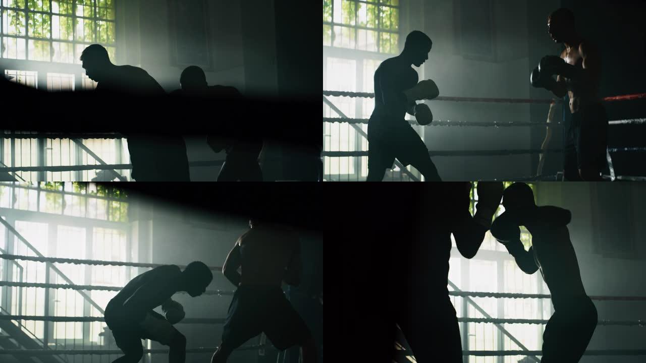 两名专业的年轻肌肉光着膀子的男性拳击手的电影慢动作镜头在拳击场上进行友好的战斗