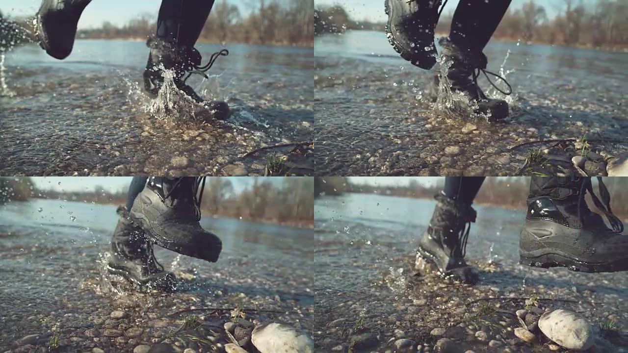 慢动作: 穿着黑色防水靴的女孩溅起清澈的湖水。