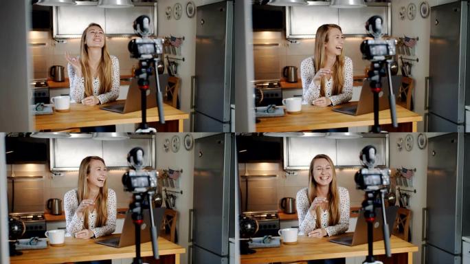年轻美丽的白人金发女人美女博客在家里录制社交媒体视频慢动作时笑了。