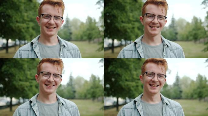 夏天公园里红头发的漂亮年轻人的肖像