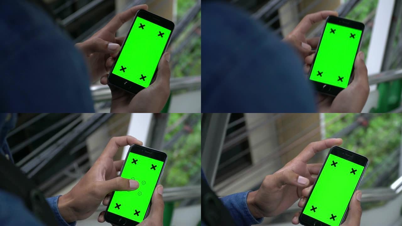 使用绿屏智能手机的特写镜头
