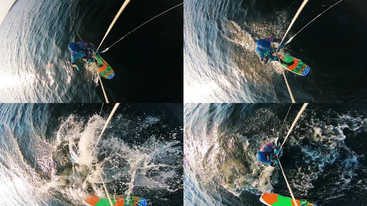 男性风筝冲浪者从板上掉下来的俯视图